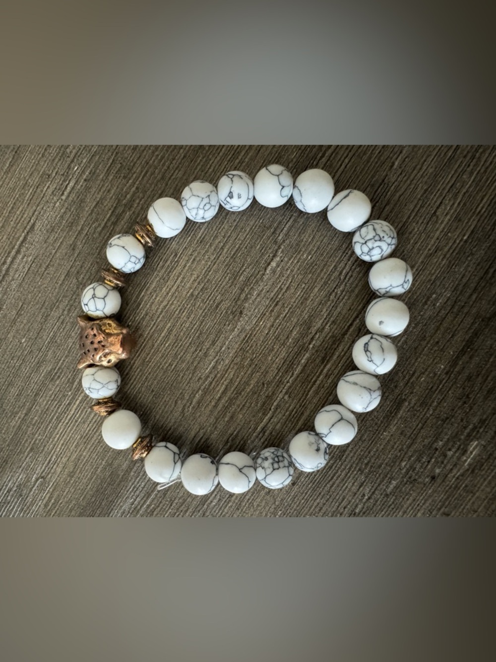 White Beaded bracelet with gold leopard charm